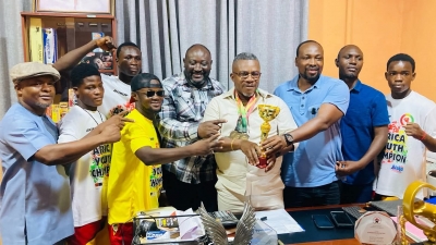 Black Rockets Present Medals And Cup To CEO Of Base Pharmacy