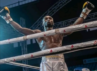 Nigerian Boxer Gabriel Oluwasegun passes during fight at Bukom Boxing Arena