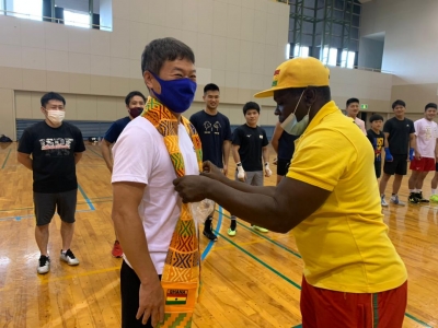 Black Bombers Present Golden Tree Chocolate And Stoles To Japanese Boxing Team